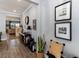 Stylish hallway featuring wood-look flooring, elegant decor, and neutral wall paint at 3404 Shallow Cove Ln, Clermont, FL 34711