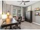 Cozy home office with a soft couch, work desk, large window, and stylish decor at 3404 Shallow Cove Ln, Clermont, FL 34711