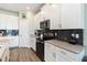 A stylish kitchen features black subway tile backsplash, stainless steel appliances, and modern cabinets at 3404 Shallow Cove Ln, Clermont, FL 34711