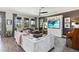 Spacious living room featuring comfortable seating, large windows, and stylish decor at 3404 Shallow Cove Ln, Clermont, FL 34711