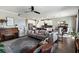 A spacious open-plan living room flows into the kitchen with gray decor and ample natural light at 3404 Shallow Cove Ln, Clermont, FL 34711