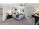 Comfortable main bedroom with a plush bed, a ceiling fan, and neutral paint at 3404 Shallow Cove Ln, Clermont, FL 34711