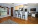 Eat-in kitchen features counter seating, updated backsplash, and an open layout at 3501 Amigos Ave, Orlando, FL 32808