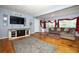 Comfortable living room with hardwood floors, stylish furniture, and plenty of natural light at 3501 Amigos Ave, Orlando, FL 32808