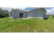 A view of the back of the house, showing an outdoor space ready for entertaining or relaxation at 428 Danube Way, Kissimmee, FL 34759