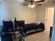 Comfortable bedroom offers a ceiling fan, closet, and wood-look floors at 428 Danube Way, Kissimmee, FL 34759