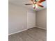 View of a neutral bedroom, showcasing the flooring and closet, illuminated by natural light at 428 Danube Way, Kissimmee, FL 34759