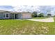 Charming single-story home with a well-maintained lawn and a two-car garage at 428 Danube Way, Kissimmee, FL 34759