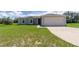 Charming single-story home with well-manicured lawn and attached two-car garage at 428 Danube Way, Kissimmee, FL 34759