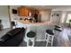 Spacious kitchen with breakfast bar seating flows into the living area at 428 Danube Way, Kissimmee, FL 34759