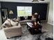 Stylish living room with large window and comfortable seating area at 428 Danube Way, Kissimmee, FL 34759