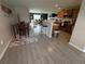 Open floor plan from dining area into kitchen and spacious living room at 428 Danube Way, Kissimmee, FL 34759