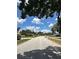 Wide street showcasing well-maintained homes and landscaping in a quiet, residential neighborhood at 448 S Meander Dr, Altamonte Springs, FL 32714