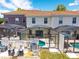 Aerial view of screened-in pools and patios in a townhouse community, providing outdoor living at 4558 Baleno Ln, Kissimmee, FL 34746