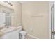 Bathroom featuring a vanity, toilet, and a walk-in shower at 4558 Baleno Ln, Kissimmee, FL 34746