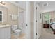 Bathroom includes shower-tub combo, toilet, vanity and access to adjacent bedroom at 4558 Baleno Ln, Kissimmee, FL 34746