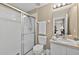 Bathroom with shower, sink, vanity, toilet, and beige paint at 4558 Baleno Ln, Kissimmee, FL 34746