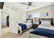Bedroom featuring two twin beds with a ceiling fan at 4558 Baleno Ln, Kissimmee, FL 34746