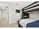 Bedroom featuring a bunk bed with closet and mounted television at 4558 Baleno Ln, Kissimmee, FL 34746