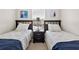 Bedroom featuring two twin beds and a nightstand between them at 4558 Baleno Ln, Kissimmee, FL 34746