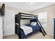 Bedroom featuring a bunk bed with closet and window at 4558 Baleno Ln, Kissimmee, FL 34746