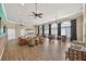 Open clubhouse area with comfortable seating, bar stools, and a kitchen in the background at 4558 Baleno Ln, Kissimmee, FL 34746