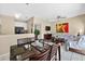 Elegant dining area connected to the living room and kitchen, with views of the pool area at 4558 Baleno Ln, Kissimmee, FL 34746