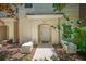 Charming townhome entrance featuring a covered entryway and a freshly landscaped garden at 4558 Baleno Ln, Kissimmee, FL 34746