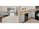 Open kitchen and dining area with modern appliances and views of the backyard pool at 4558 Baleno Ln, Kissimmee, FL 34746