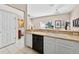 The kitchen area has sleek appliances, ample counter space, and backyard views at 4558 Baleno Ln, Kissimmee, FL 34746