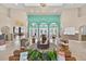 Spacious lobby featuring tiled flooring, high ceilings, elegant seating, and a reception area at 4558 Baleno Ln, Kissimmee, FL 34746