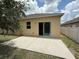 A view of the backyard with a patio and sliding glass doors at 4792 Summerfield Cir, Winter Haven, FL 33881