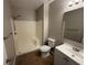 Bathroom featuring a shower, toilet, vanity, and mirror at 4792 Summerfield Cir, Winter Haven, FL 33881