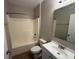 Bathroom featuring a shower-tub combo, toilet, vanity, and mirror at 4792 Summerfield Cir, Winter Haven, FL 33881