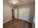 Bedroom featuring neutral walls, wood-look flooring and closet space at 4792 Summerfield Cir, Winter Haven, FL 33881