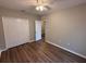 Bedroom featuring neutral walls, wood-look flooring and closet space at 4792 Summerfield Cir, Winter Haven, FL 33881