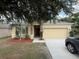 Charming one-story home with stone accents, a well-maintained yard, and a two-car garage at 4792 Summerfield Cir, Winter Haven, FL 33881