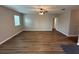 Spacious living room with wood-look floors and neutral walls, perfect for entertaining at 4792 Summerfield Cir, Winter Haven, FL 33881