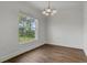 Dining room features a modern chandelier and large window with a backyard view at 4836 Pierce Arrow Dr, Apopka, FL 32712
