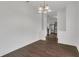 Bright dining area with modern light fixture flows into the updated kitchen at 4836 Pierce Arrow Dr, Apopka, FL 32712