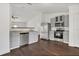 Updated kitchen features gray cabinets, granite counters, and stainless steel appliances at 4836 Pierce Arrow Dr, Apopka, FL 32712