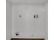 This laundry room has washer and dryer hookups and a wire shelf for storage at 4836 Pierce Arrow Dr, Apopka, FL 32712