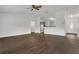Open-concept living room boasts wood-look floors and an abundance of natural light at 4836 Pierce Arrow Dr, Apopka, FL 32712