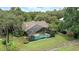 An aerial view of the home, pool and large grassy lawn at 518 Stephanie Ct, Lake Mary, FL 32746