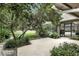 Private backyard featuring a pool, mature landscaping, and an expansive concrete patio with a covered area to sit and grill at 518 Stephanie Ct, Lake Mary, FL 32746