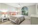 Cozy bedroom with a large window offering natural light and decorative lamps at 518 Stephanie Ct, Lake Mary, FL 32746