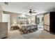 Spacious bedroom with neutral tones, ceiling fan, and French doors leading to the backyard at 518 Stephanie Ct, Lake Mary, FL 32746