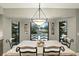 Charming dining area featuring backyard views and access to the screened-in pool at 518 Stephanie Ct, Lake Mary, FL 32746