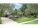 Manicured landscaping and a long driveway lead to this charming brick home at 518 Stephanie Ct, Lake Mary, FL 32746