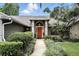 A walkway leads to the front door surrounded by lush landscaping at 518 Stephanie Ct, Lake Mary, FL 32746